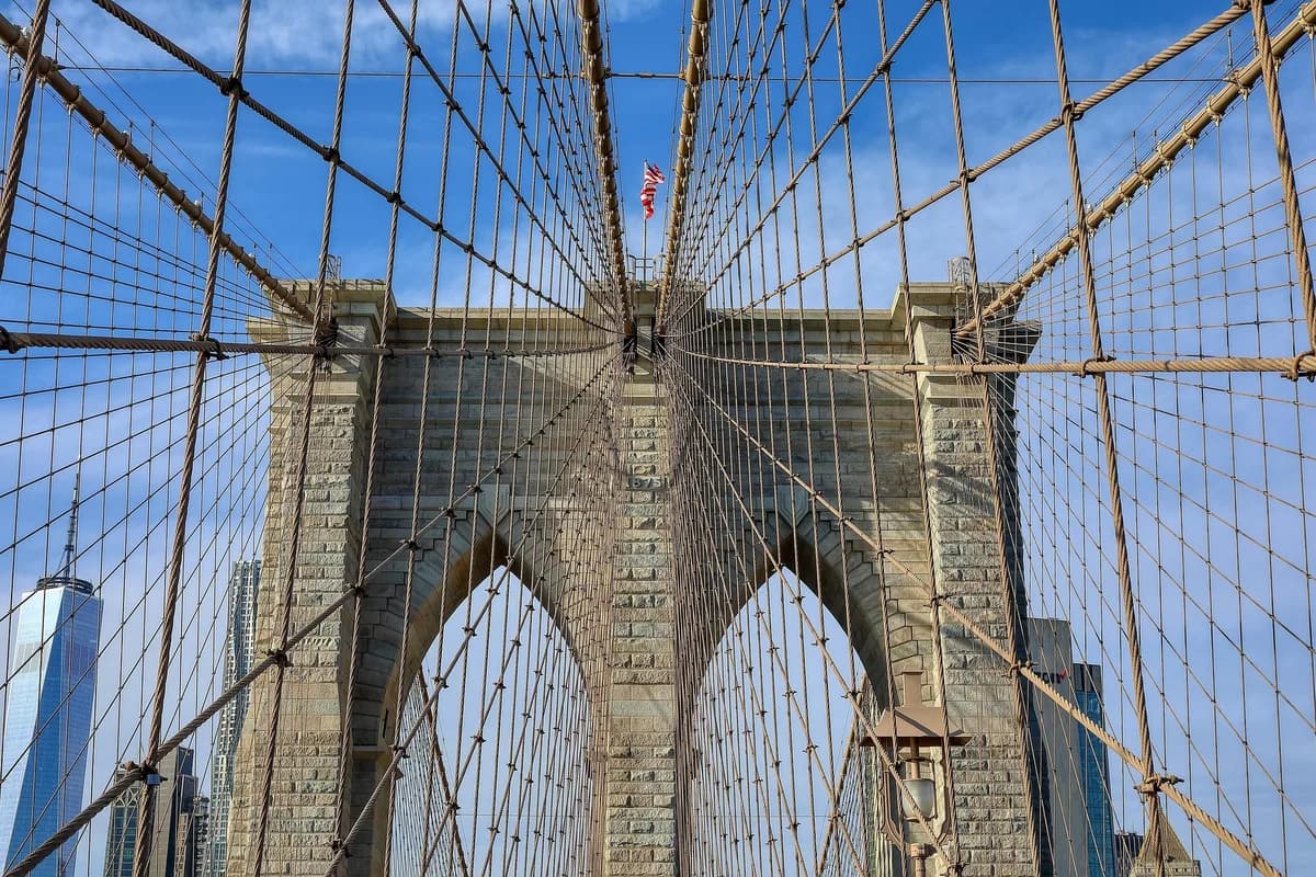 Cables of the Brooklyn Bridge against a clear sky