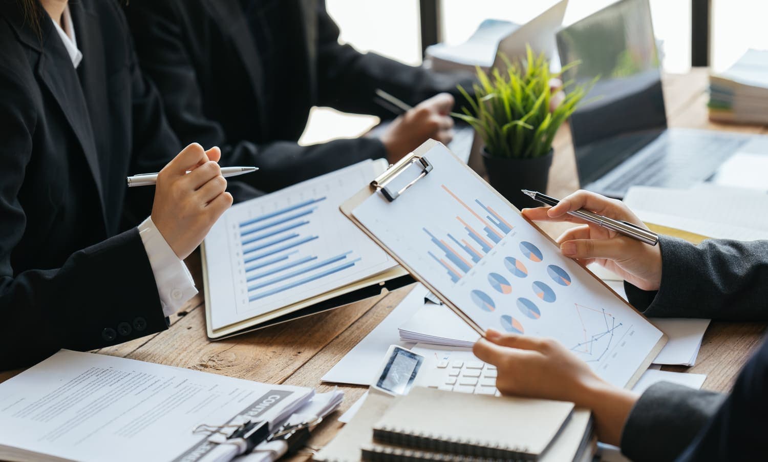 Auditors reviewing financial charts together