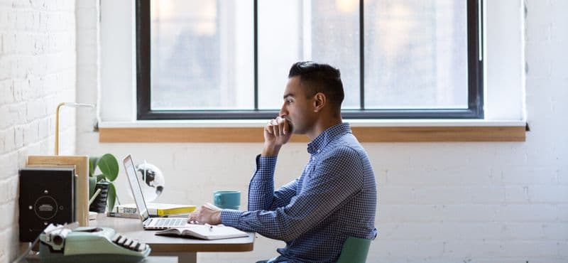 A finance lead reading a lender request at their desk