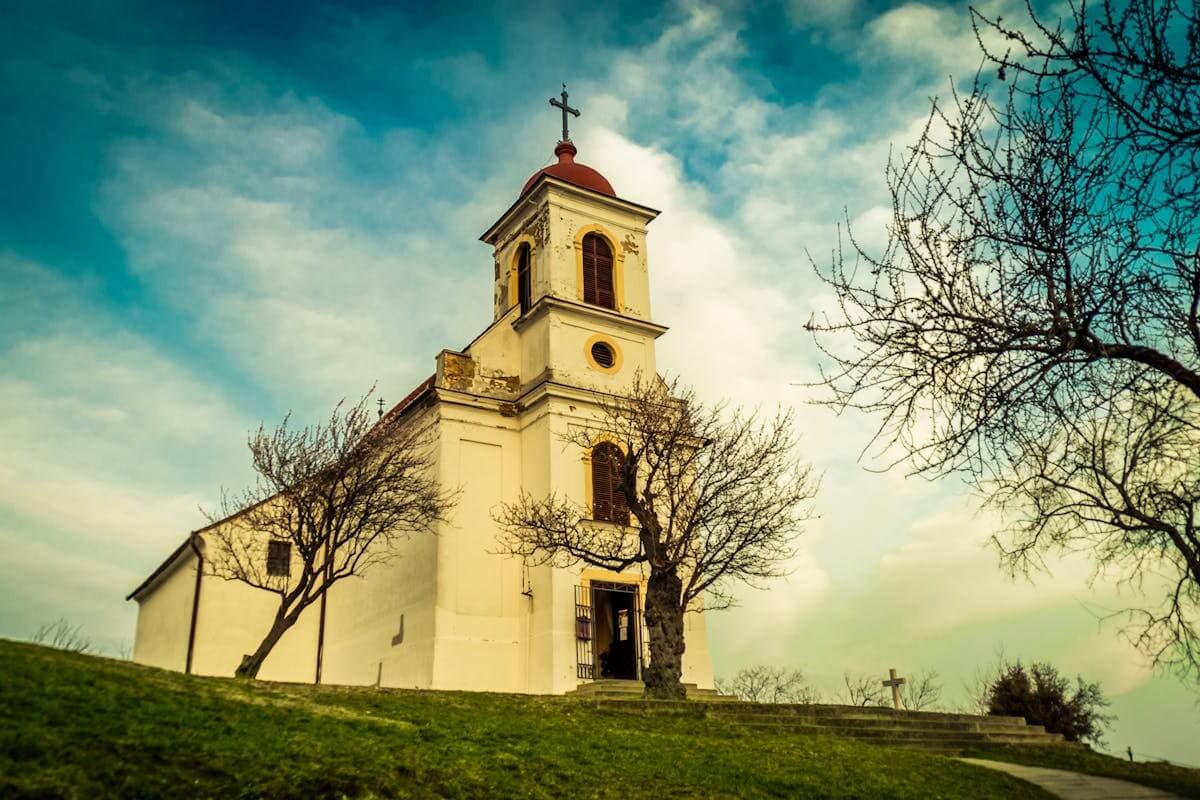 Church with a bell tower on a hillside